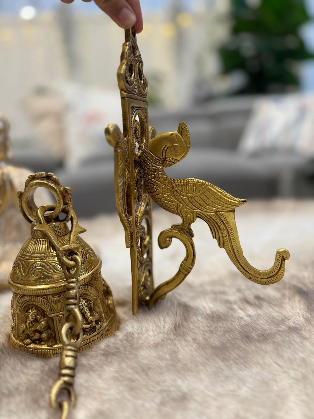 Brass Temple bell engraved with Ganesha in musical avatars having peacock hooks