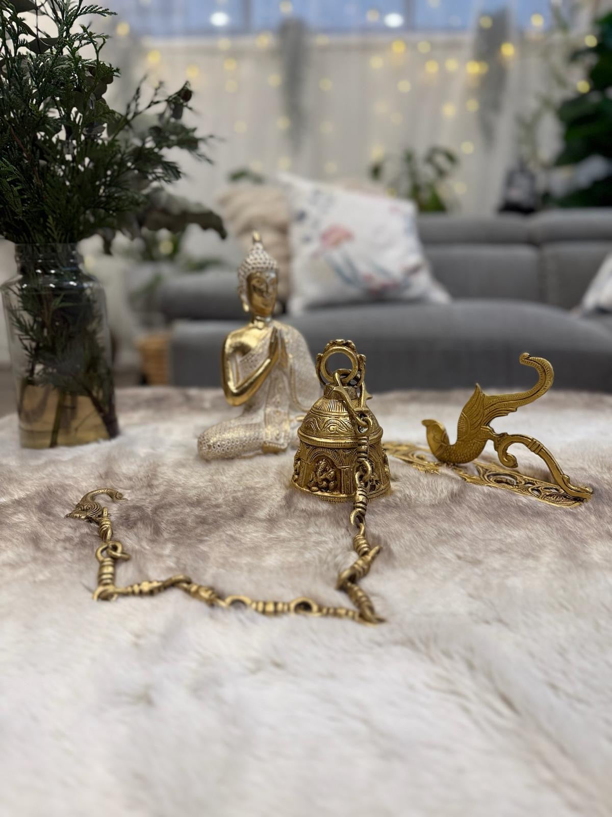 Brass Temple bell engraved with Ganesha in musical avatars having peacock hooks